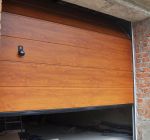 Why Does My Garage Door Open and Close By Itself?