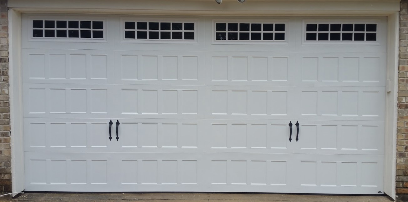 This is a recessed double door that was an average garage door size fo 16 feet wide by 8 feet in height.