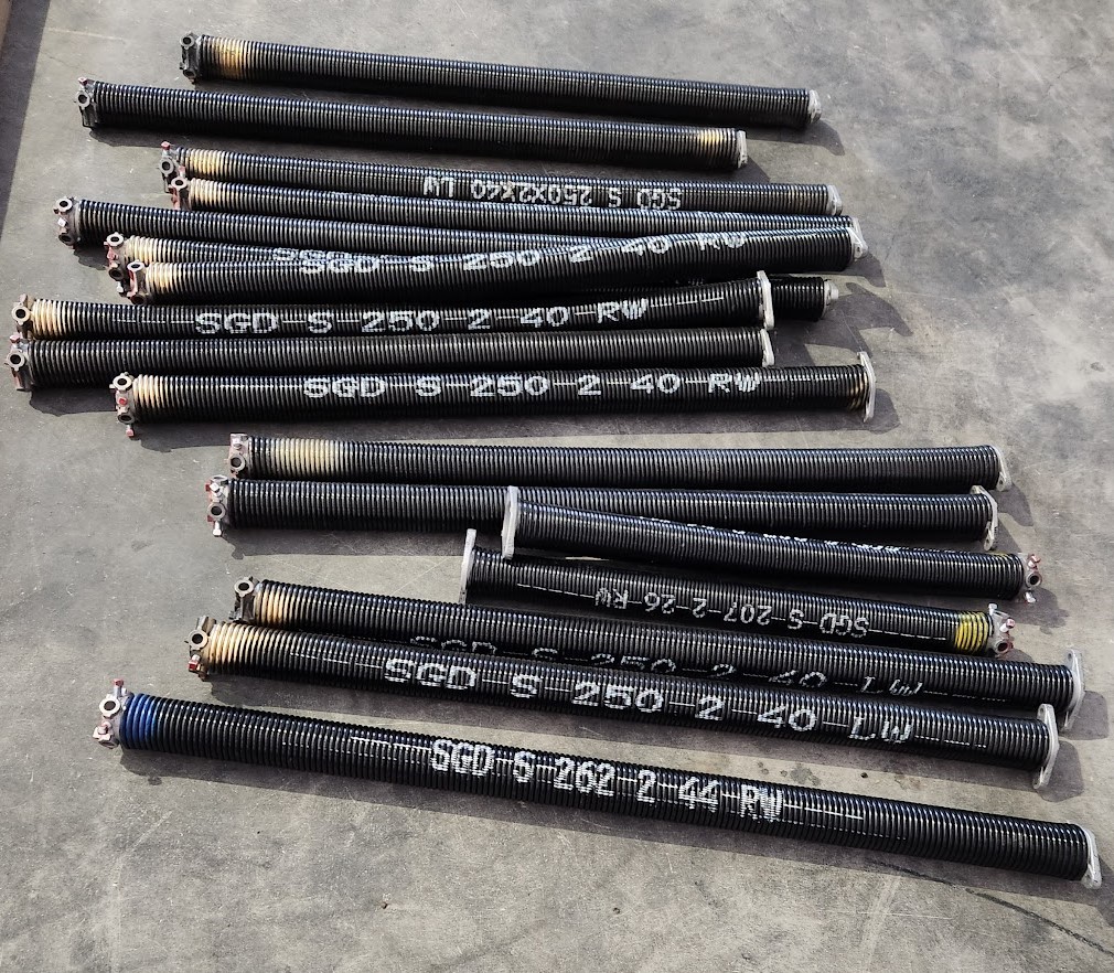 Hard Cycle Spring High Cycle Garage Door Springs vs. 10,000 Cycle Springs: